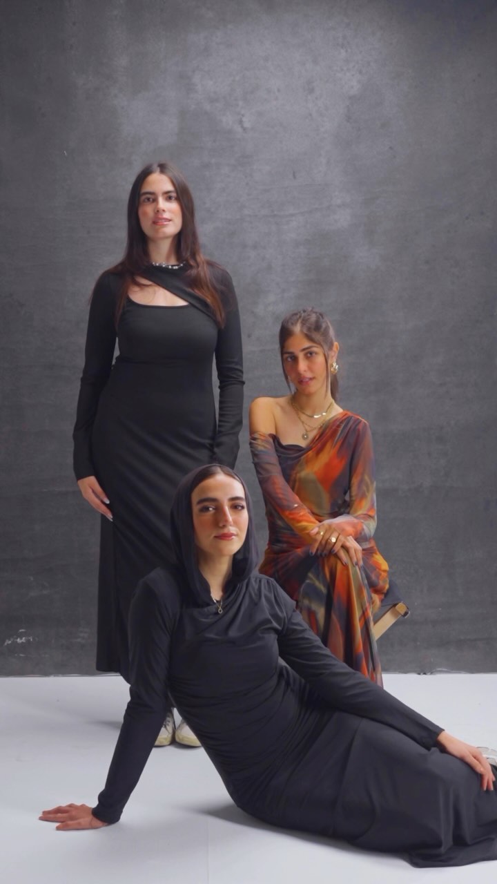 Two models in Tryout Fit co-ord sets, seated editorial